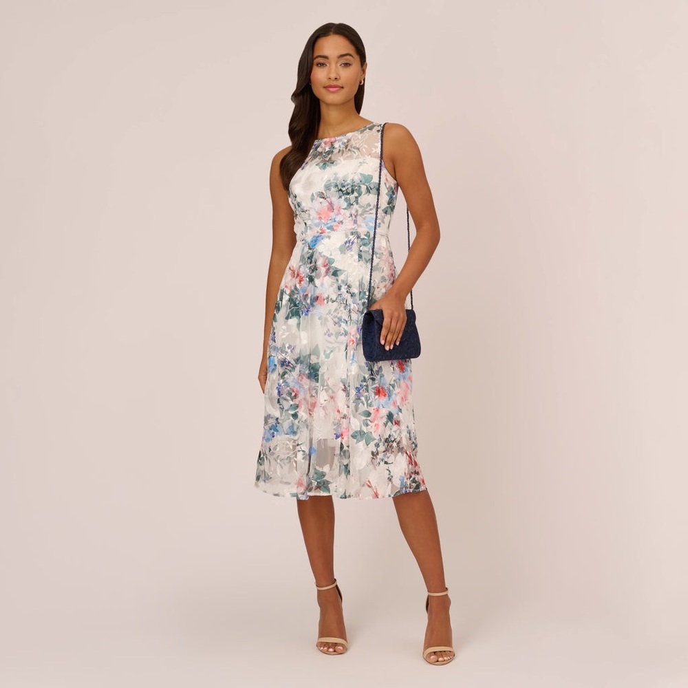 ADRIANNA PAPELL 
FLORAL SLEEVELESS MIDI DRESS WITH SHEER DETAILS IN IVORY MULTI